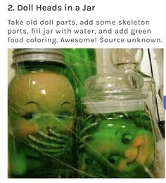 two doll heads in a jar with water and green food coloring, awesome source unknown