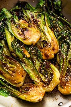 stir fried vegetables with sesame seeds in a pan