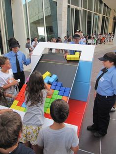 several children are playing with an interactive cube