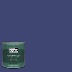 a can of behr ultra stain - blocking paint on a blue background