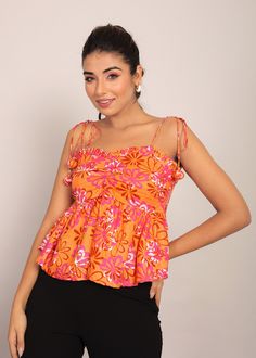 *The floral print, an exquisite medley of vibrant colors, transforms this crop top into a wearable garden of enchantment.  *The square neckline adds a touch of modern sophistication, creating a perfect blend of timeless charm and trendy allure.  *With sleeveless elegance, this top is designed for those sun-soaked days or nights out on the town.  *Tailored to be fitted at the bust, this crop top highlights your feminine curves while providing a flattering and comfortable silhouette.  *Crafted from soft and breathable cotton fabric, it ensures a luxurious feel against your skin, promising comfort that lasts all day.  *The top wear length gracefully reaches the waist, offering a versatile canvas for styling - pair it with high-waisted bottoms for a chic ensemble that effortlessly transitions Multicolor Sleeveless Top With Vibrant Print, Multicolor Print Fitted Sleeveless Top, Fitted Multicolor Print Sleeveless Top, Fitted Sleeveless Multicolor Print Top, Vibrant Print Sleeveless Top For Vacation, Sleeveless Top With Vibrant Print For Vacation, Multicolor Floral Print Crop Top For Vacation, Multicolor Sleeveless Top For Spring, Multicolor Sleeveless Spring Blouse