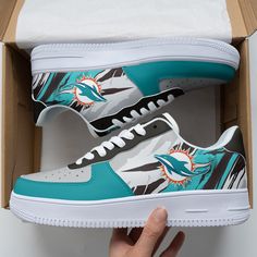 Miami Dolphins Af1 Shoes 266 Lightweight construction with breathable mesh fabric provides a comfortable and flawless fit. Miami Dolphins Shoes, Dolphins Logo, Af1 Shoes, Expressive Fashion, Miami Dolphins, Classic Silhouette, Black Laces, Dinosaur Print, Sneakers Shoes