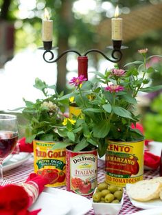 the table is set with wine, bread and vegetables for an outdoor dinner party or gathering