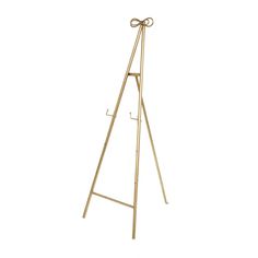 a wooden easel with a bow on the top and two metal bars attached to it