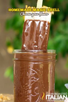 there is a chocolate drink in a jar with a straw sticking out of the top