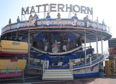 a carnival ride with people riding on it