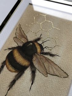 a painting of a bee on the ground