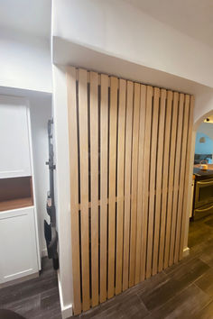 a room divider made out of wooden slats