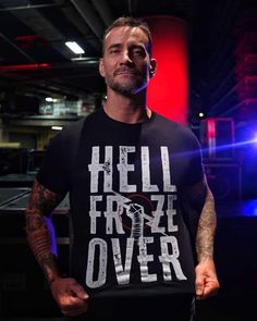 a man wearing a black t - shirt that says hell friskze over