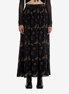 Searching for a darker celestial look? This mesh maxi skirt is printed allover with moons and suns with skulls in them  in a black and gold colorway. This skirt is fully lined and has an elasticated waist.80% polyester; 18% rayon; 2% spandexWash cold; dry lowLength: 38"ImportedListed in junior sizesModel is 5'10"Model wears size Small Soft Goth Plus Size, Plus Sized Clothing, Planetarium Outfit, Hippy Skirts, Celestial Grunge, Adult Alternative Fashion, 1999 Fashion Trends, Black Skirt Maxi, Grunge Long Skirt