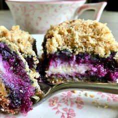 blueberry crumb bars on a plate with a spoon