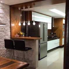 the kitchen is clean and ready to be used as a dining room or living room