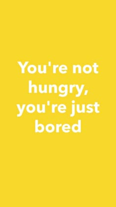 a yellow background with the words you're not hungry, you're just bored