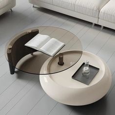 a coffee table with an open book on it