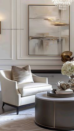 an elegant living room with white furniture and chandelier