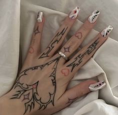 a woman's hand with white and black designs on it