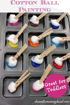 cotton ball painting with toothpicks in an ice tray