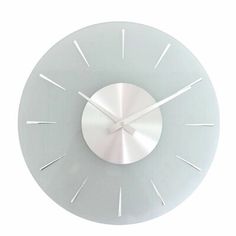 a white clock with silver hands and numbers on it's face is shown against a white background