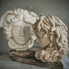 there are two sculptures made to look like heads