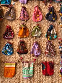 many small purses are lined up on the floor