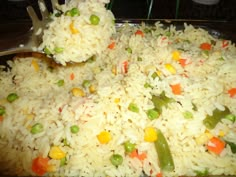 rice with peas and carrots in a pan