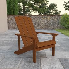 a wooden chair sitting on top of a stone patio