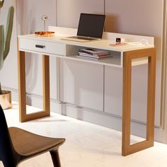 a laptop computer sitting on top of a white desk