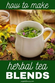 a white tea cup filled with herbs on top of a wooden table