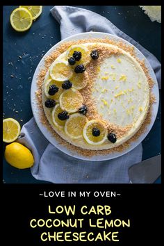 a cake with lemons and blackberries on top is shown in the middle of this postcard