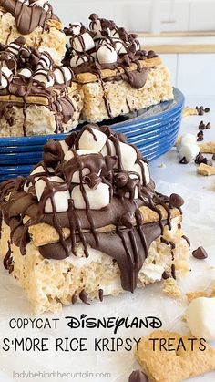 some kind of dessert with marshmallows and chocolate on top in a blue bowl