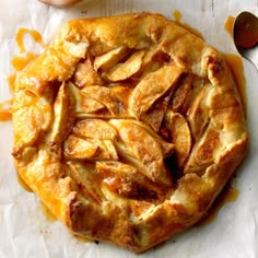 an apple pie with caramel drizzled on top