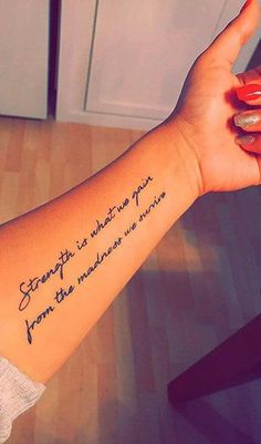 a woman's arm with a tattoo saying strength is what you from the middle distance