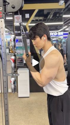 a man is doing exercises in the gym with an electronic device on his arm and chest