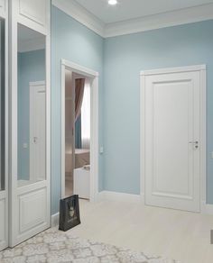 an empty room with blue walls and white trim on the door, carpeted floor