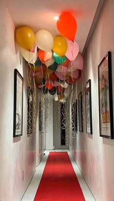 the hallway is decorated with balloons and streamers