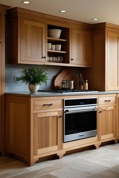 a kitchen with wooden cabinets and stainless steel appliances