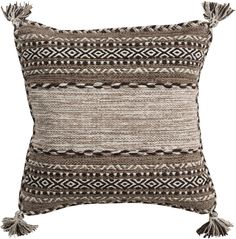 a brown and white pillow with tassels