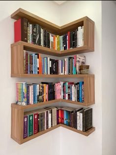 a corner book shelf with several books on it