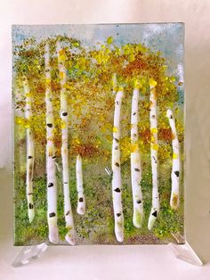 an acrylic painting of white birch trees in the fall with yellow and green leaves