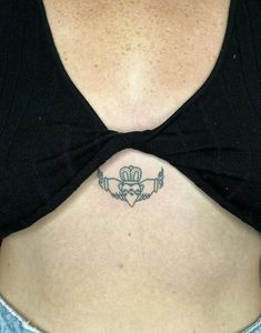 a woman with a tattoo on her stomach