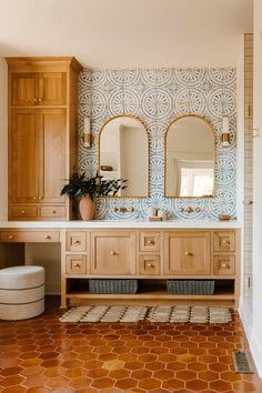 a large bathroom with wooden cabinets and tile flooring