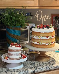 two cakes sitting on top of a kitchen counter