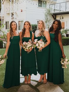 the bridesmaids are all wearing green dresses and holding bouquets in their hands