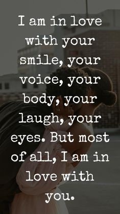 a couple kissing each other with the words i am in love with your smile, your voice