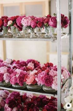 several shelves filled with vases and flowers