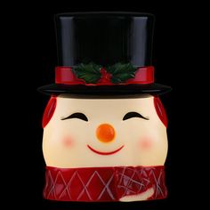 a ceramic snowman with a top hat and scarf on it's head is shown