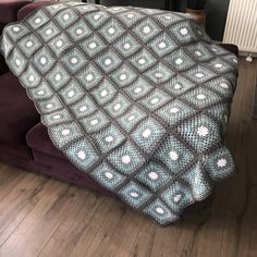 a blanket that is on top of a couch