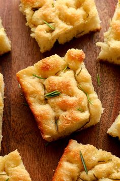 several pieces of bread with rosemary on top