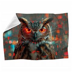 an owl with glowing red eyes is shown on the cover of a bedding set