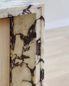 a marbled wooden table with white and brown paint